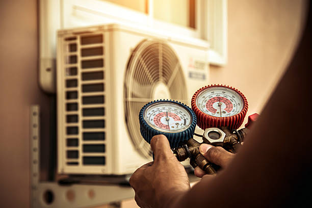 Professional Air Conditioning Service technician working in Leiters Ford, IN